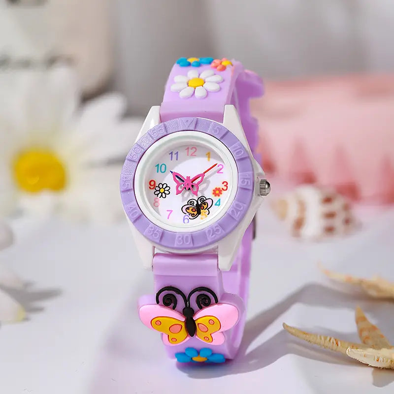 A pastel purple girls butterfly silicone quartz watch with a white face featuring colorful butterfly and bee decorations and a matching strap with a 3D pink and yellow butterfly charm.