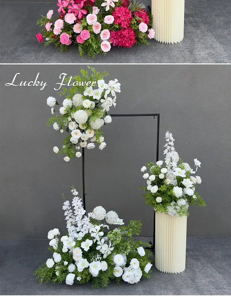 A tall cream-colored ribbed vase holds a lush arrangement of white artificial flowers and greenery for a wedding arch floral backdrop.
