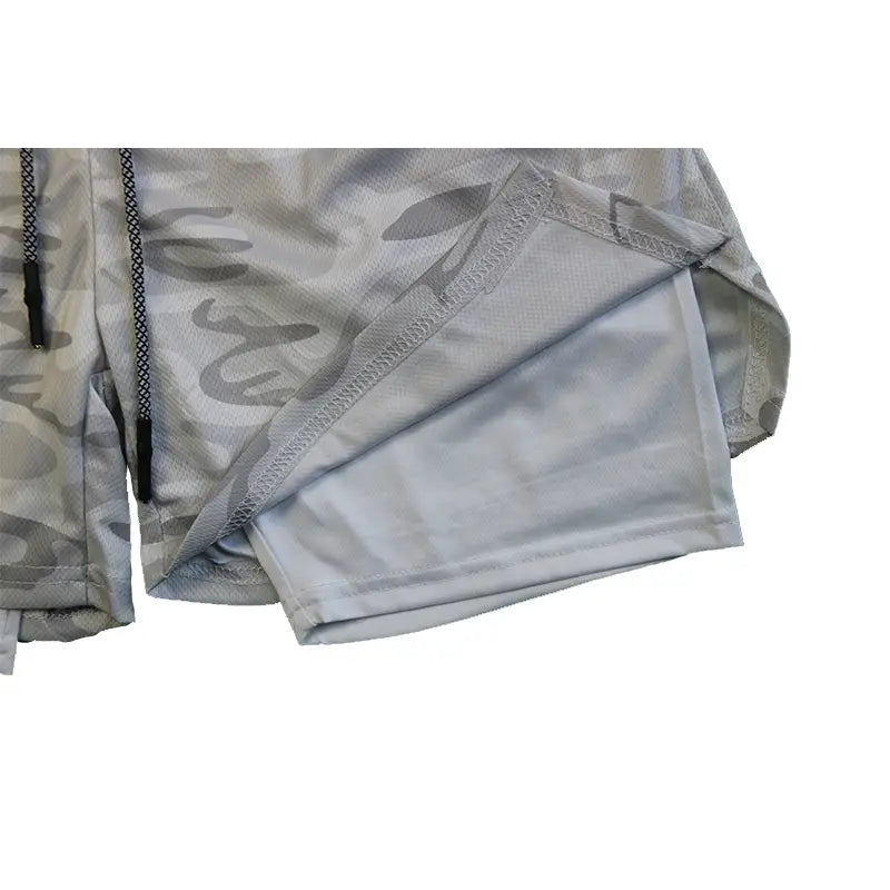 men 2 in 1 gym shorts in gray camouflage with mesh lining and black drawstrings designed for quick dry workout activewear.