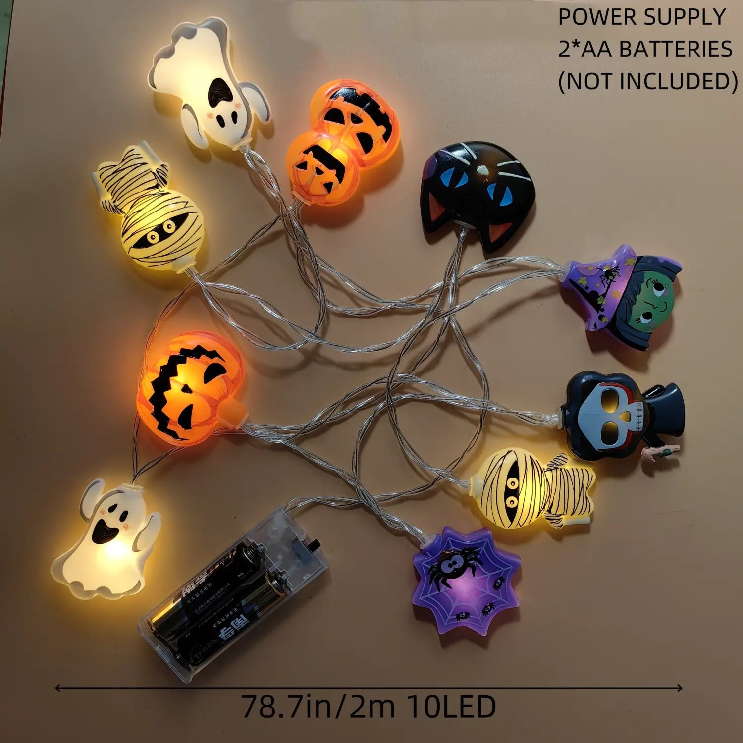 Halloween led string lights featuring glowing orange yellow purple and black plastic figures of ghosts pumpkins mummies cats witches skulls and spiders for festive pumpkin ghost decor.