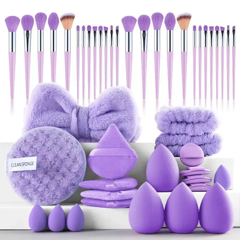 a 46 piece pink makeup brush and sponge set featuring lavender-colored brushes and soft fluffy sponges designed for precise makeup application and eye makeup application