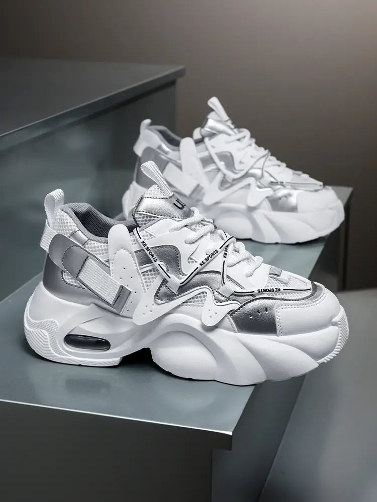 Men chunky air cushion casual sneakers in white and silver featuring a bold layered design with mesh and synthetic overlays.
