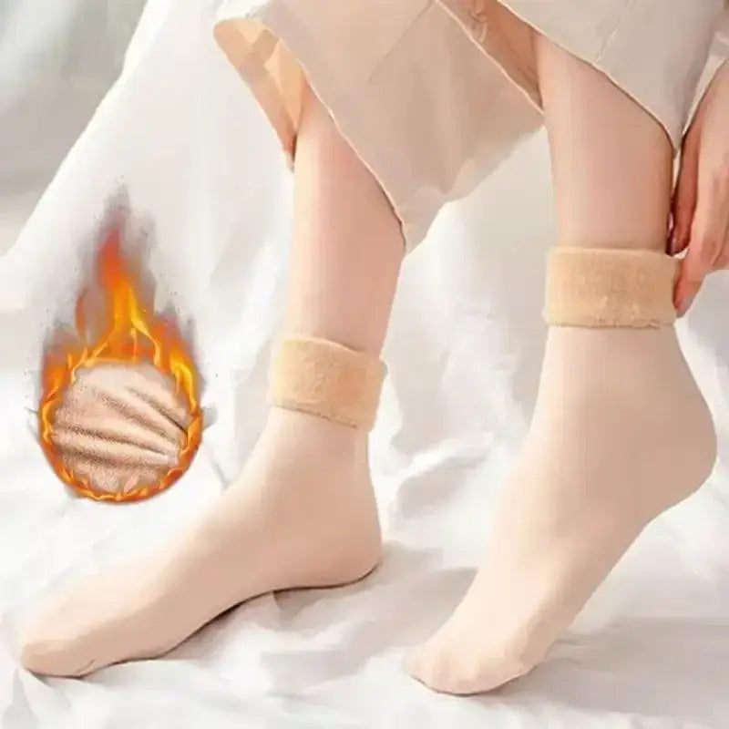 Beige winter thermal socks made of cashmere wool with a plush fuzzy cuff for added warmth.