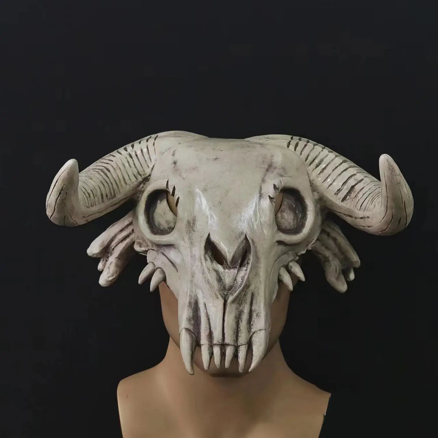 Off-white halloween cosplay mask featuring a detailed ram skull headpiece with textured horn ridges and sharp teeth for cosplay use.
