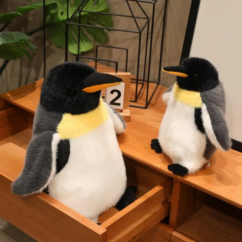 soft plush penguin stuffed animal soft toy pair in black white and yellow coloring made from soft material