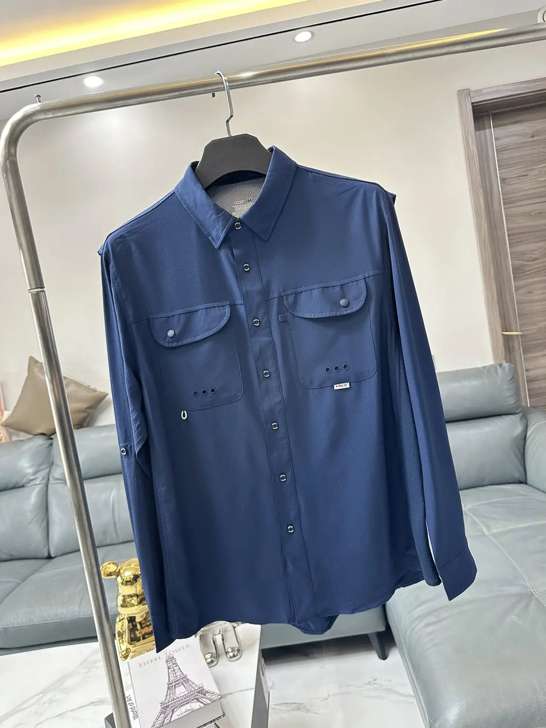 Men’s tactical outdoor long sleeve shirt in deep blue with two chest pockets and subtle white stitching details.