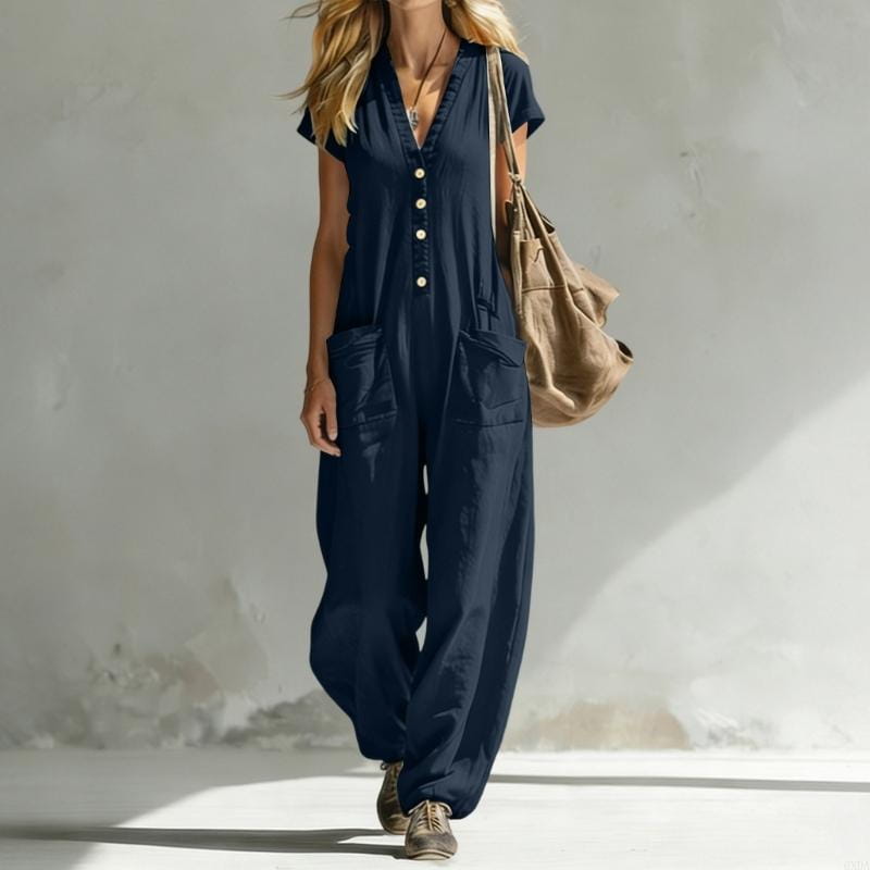 Navy blue short-sleeved women wide leg jumpsuit with button-front closure and large side pockets made from lightweight fabric for casual wear.