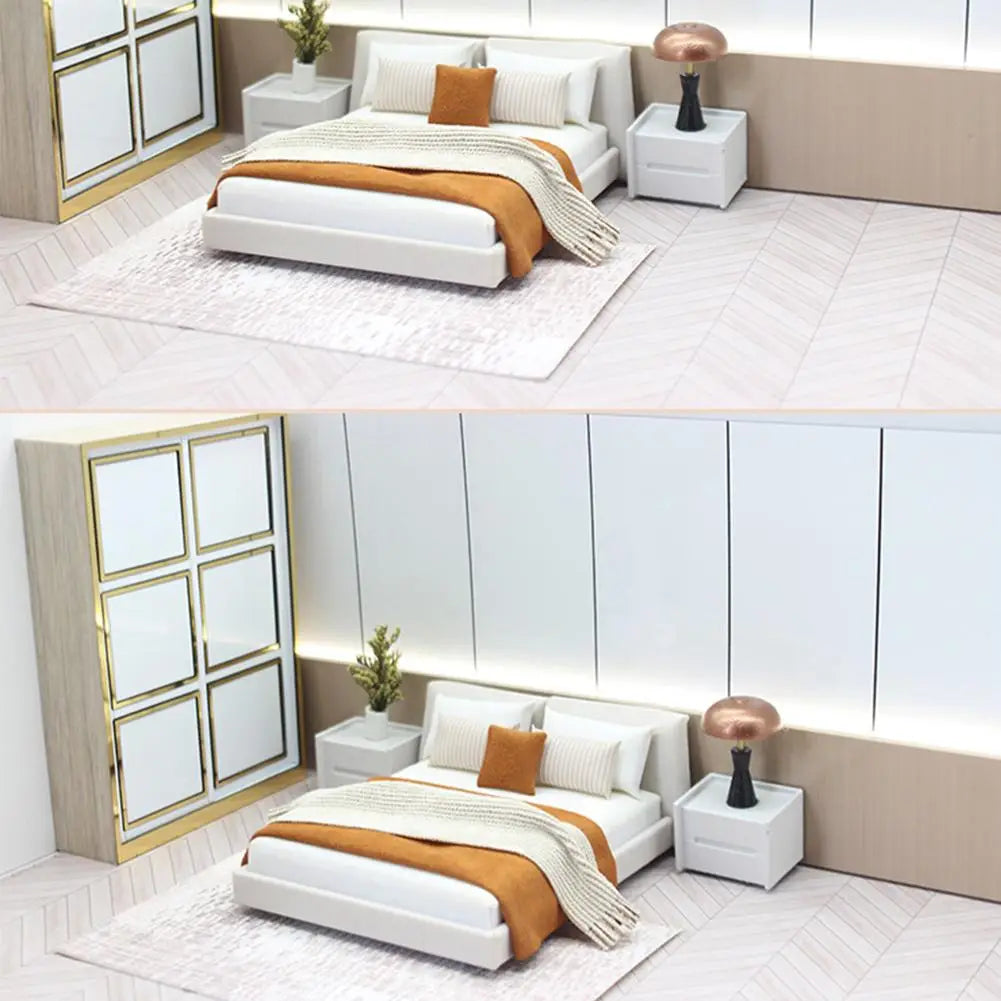Miniature dollhouse double bed with cream style white platform frame, orange throw blanket, and striped pillows with bedding.