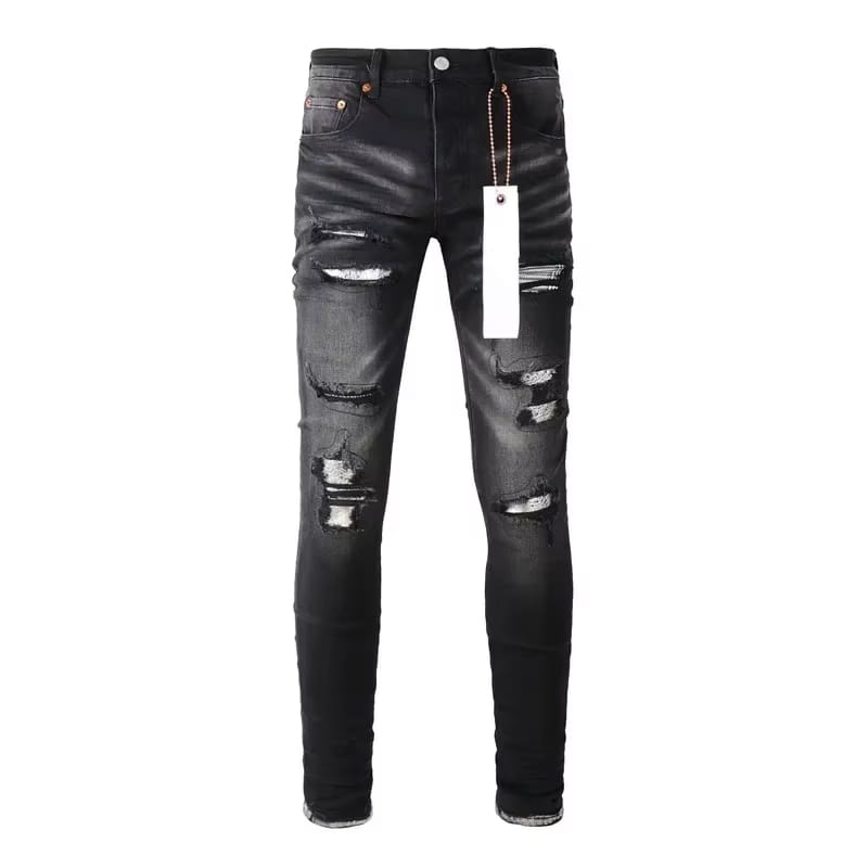 Black distressed patchwork skinny jeans featuring ripped knees and faded wash in black denim.