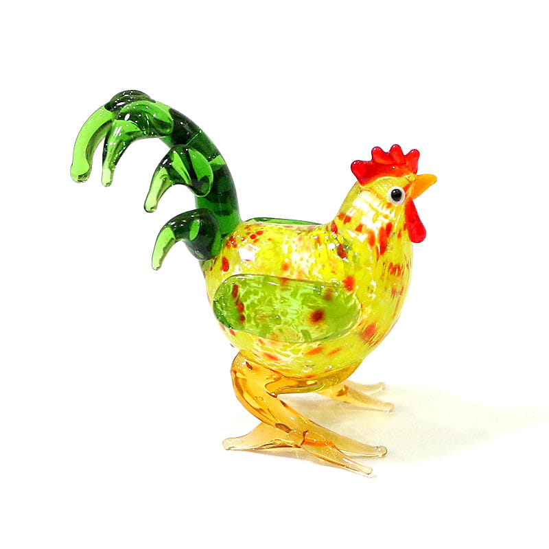 Vibrant yellow and green glass rooster miniature figurine with red comb and wattle speckled patterns and a glossy finish suitable as an Easter ornament.