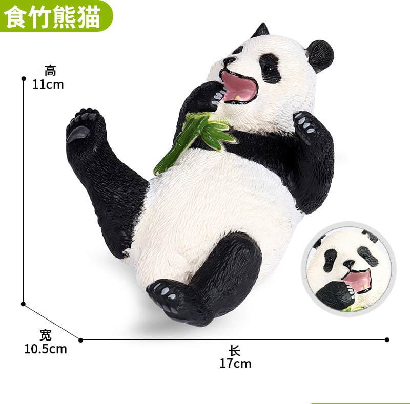 A black and white plastic soft animal figurine decompression toy finished good features a lounging panda holding a green bamboo stalk measuring 17cm long and 10.5cm wide.