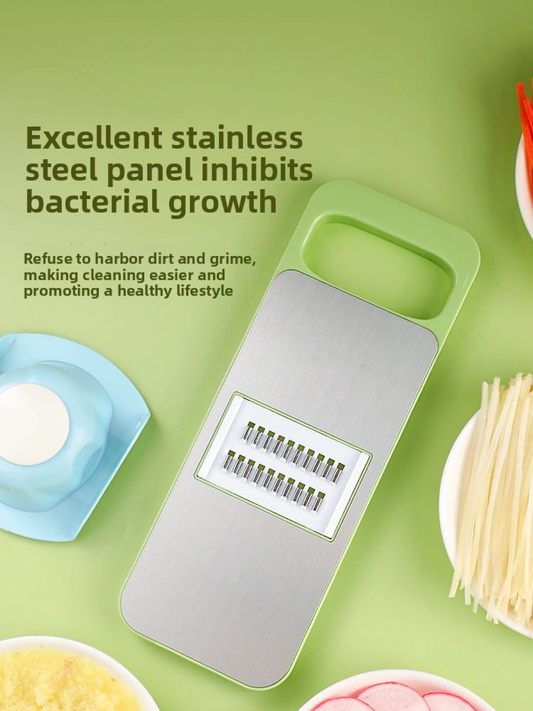 Green-handled stainless steel multi-functional vegetable slicer shredder with a sleek rectangular design and multiple fine blades for precise slicing and shredding.