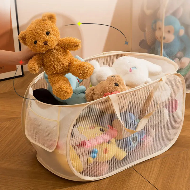 beige mesh laundry basket with handles used as a large capacity toy storage organizer filled with stuffed animals