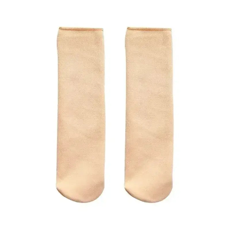 a pair of beige winter thermal socks made from cashmere wool with a smooth texture and subtle ribbed cuff fleece lined for warmth