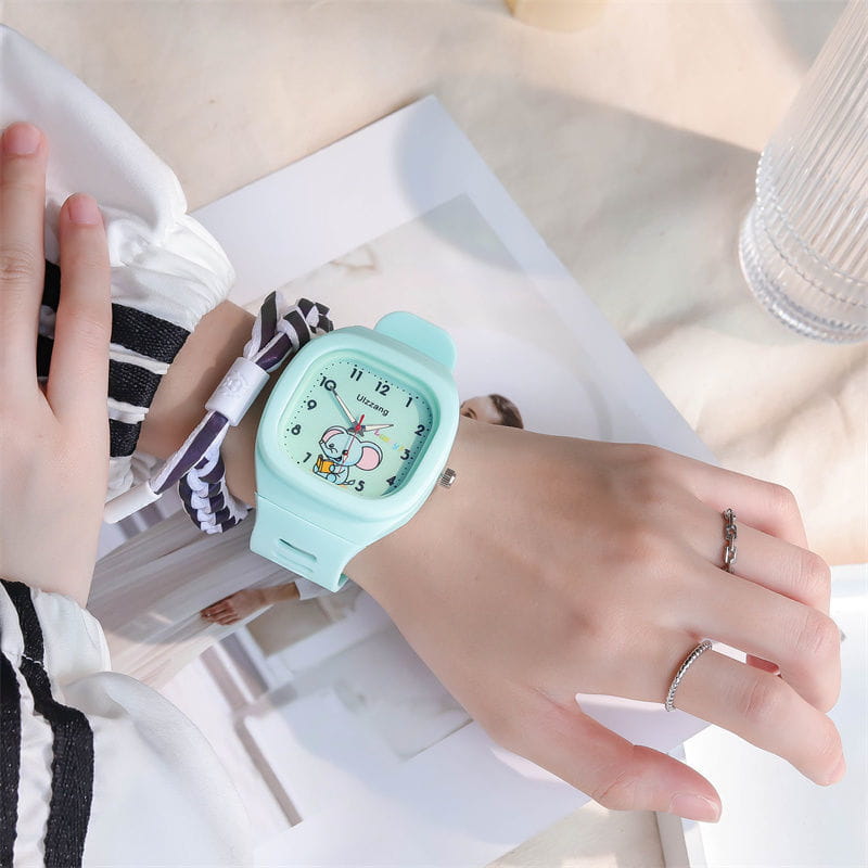 Kids luminous cartoon elephant digital watch featuring a mint green square face with a cartoon character design on the dial.