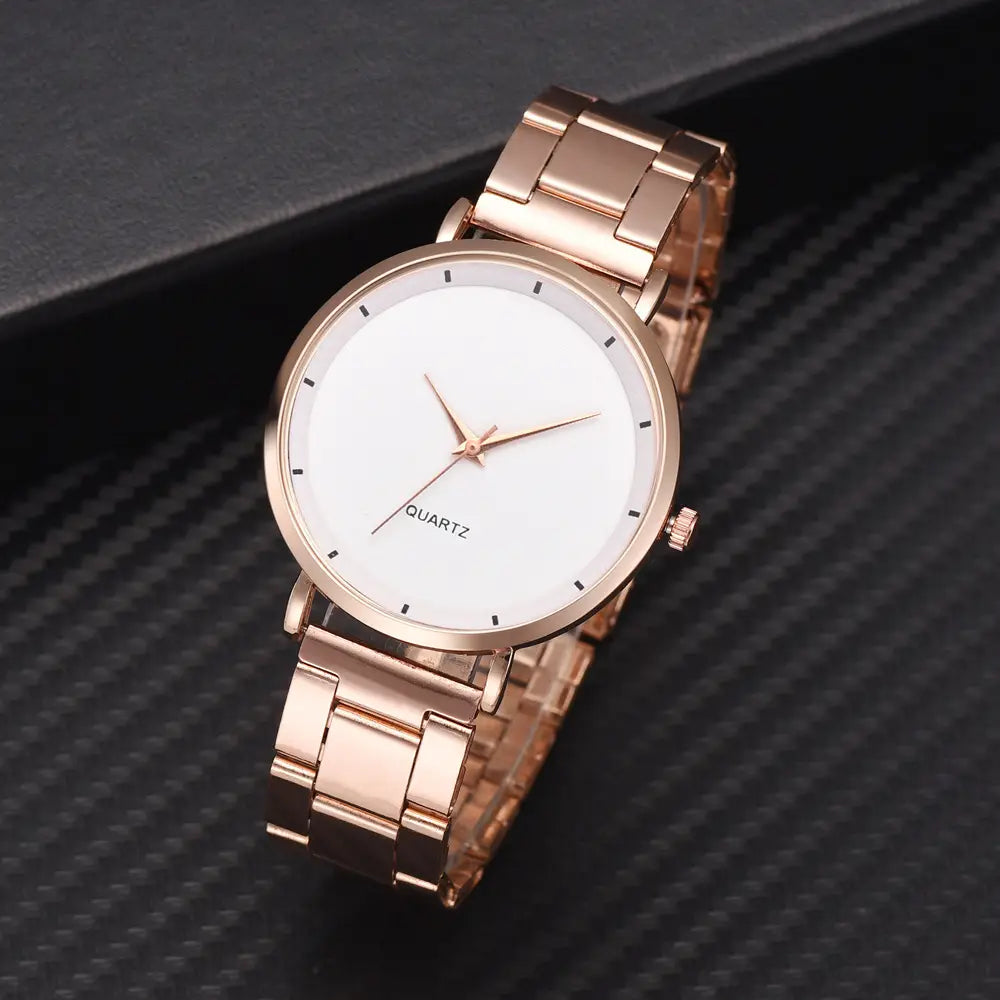 Rose gold women luxury quartz wristwatch featuring a stainless steel case with a minimalist white dial and simple black hour markers suitable for business use.