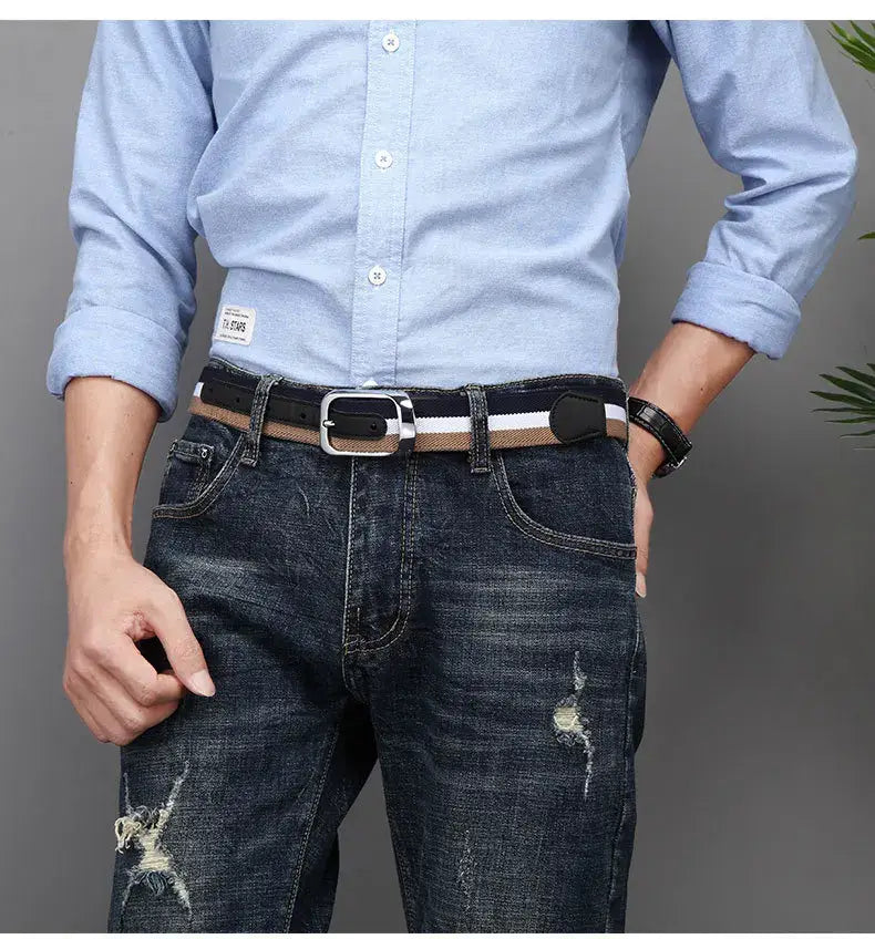 Black and tan striped leather belt with a silver-toned buckle designed as a casual waistband for men.
