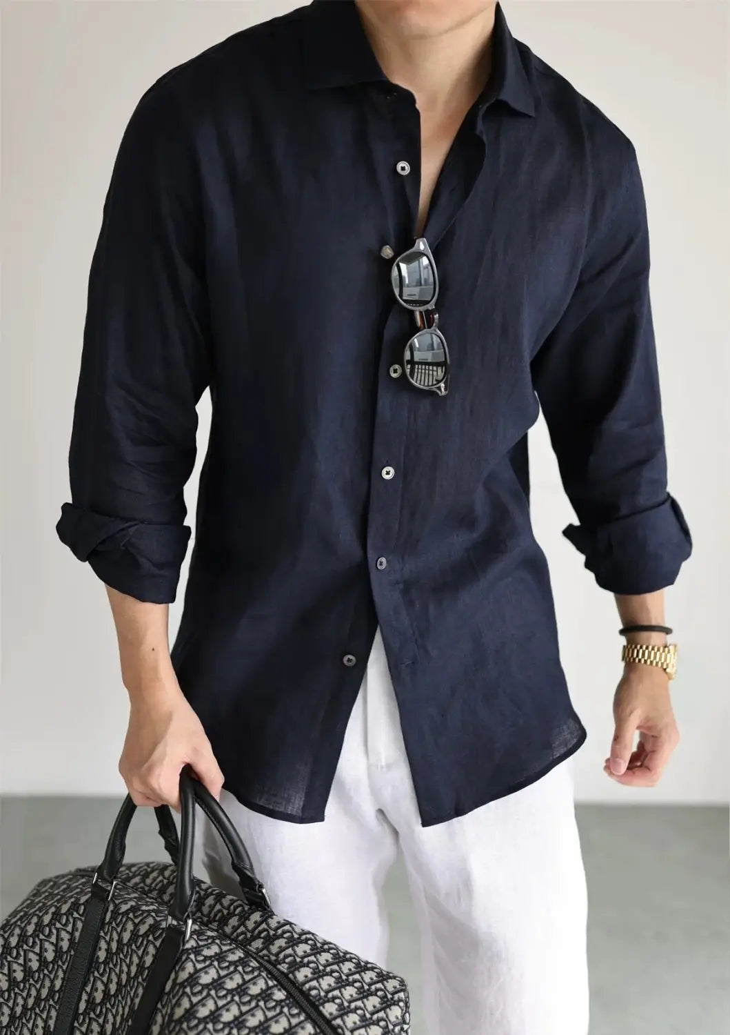 Navy blue cotton linen casual button down shirt with rolled sleeves and silver buttons.