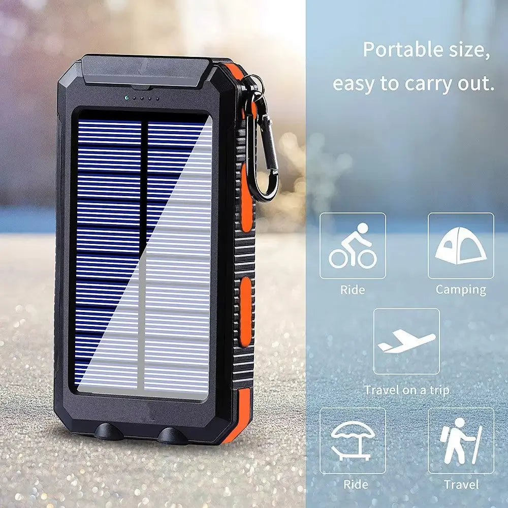 Banco de energía solar resistente negro y naranja de 80000 mAh con carga rápida, cargador portátil con clip tipo mosquetón incorporado, diseñado para uso al aire libre.