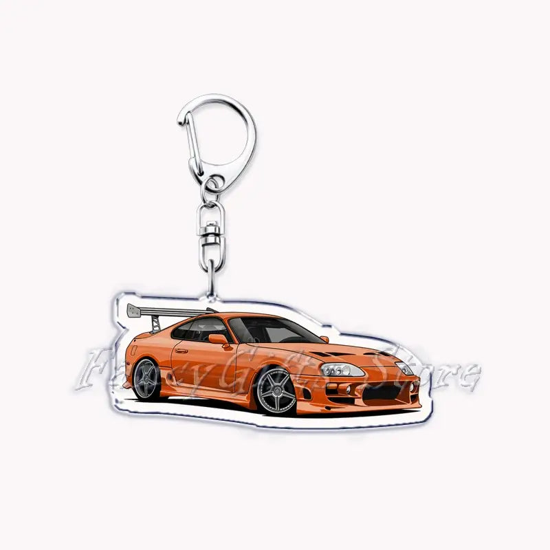 Orange acrylic Nissan Skyline keychain featuring a detailed illustration of a modified sports car with black rims and a rear spoiler.