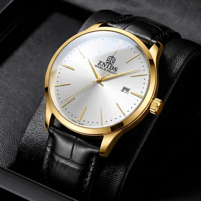 Automatic skeleton mechanical watch featuring a gold-tone Znids world peace case, silver dial, black leather strap, and gold hands.