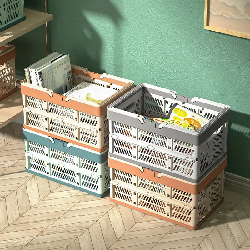 Foldable plastic storage basket pastel collapsible crate featuring stacked collapsible plastic storage crates in pastel orange gray and teal with a grid-like pattern.
