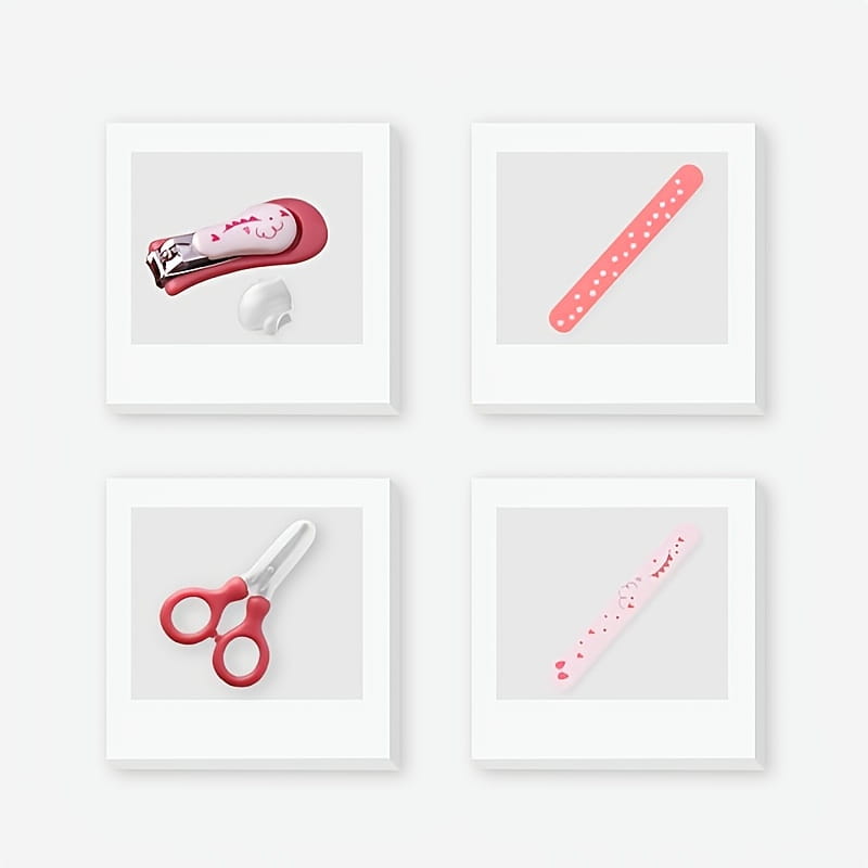 pink and silver baby nail clipper with a cute face design from a baby nail care set 4-piece grooming kit for infant nail trimming.