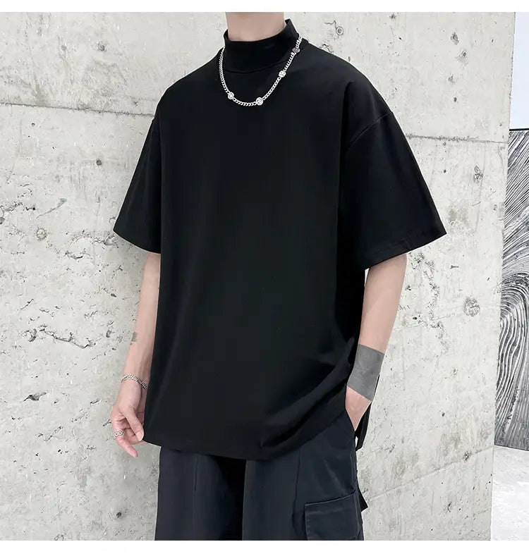 Black oversized turtleneck t-shirt with short sleeves made for casual streetwear in a comfortable fabric.