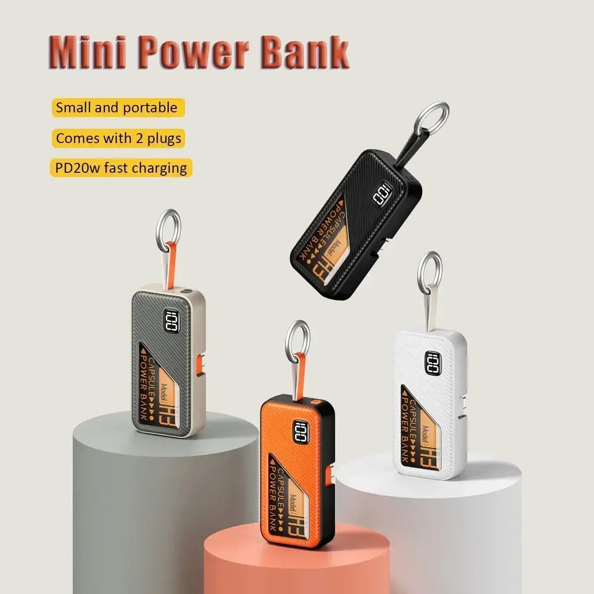 Black orange and white mini portable power banks with textured carbon fiber finish and keychain attachment featuring a digital display fast charger and 5000mAh capacity.