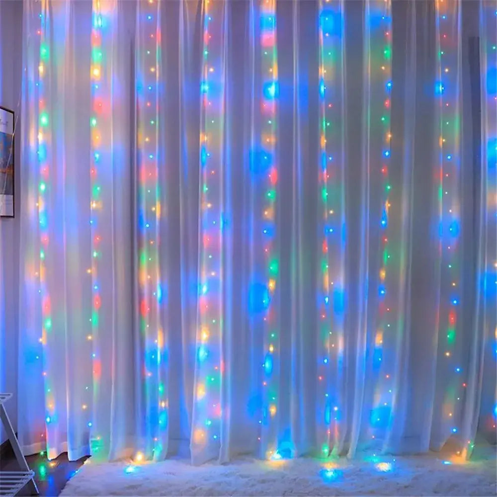 A string of colorful led curtain fairy lights with usb remote features vibrant blue green and warm yellow hues draped vertically across a sheer white curtain for bedroom decor.
