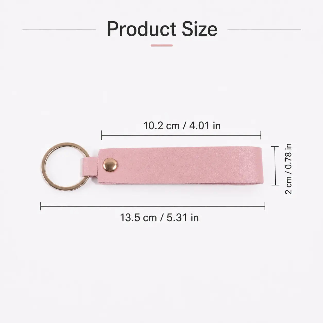 A sleek light pink leather custom name keychain with a gold toned metal ring and button closure.