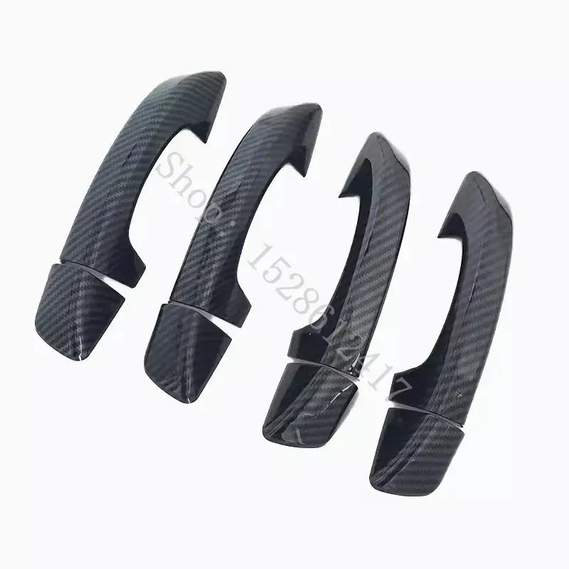 Black carbon fiber textured door handle cover trims designed for VW Passat car doors.