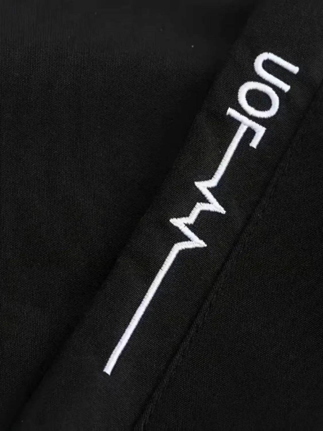 black fabric with white embroidered uofm text on the back of men off road hooded jacket windproof casual outerwear