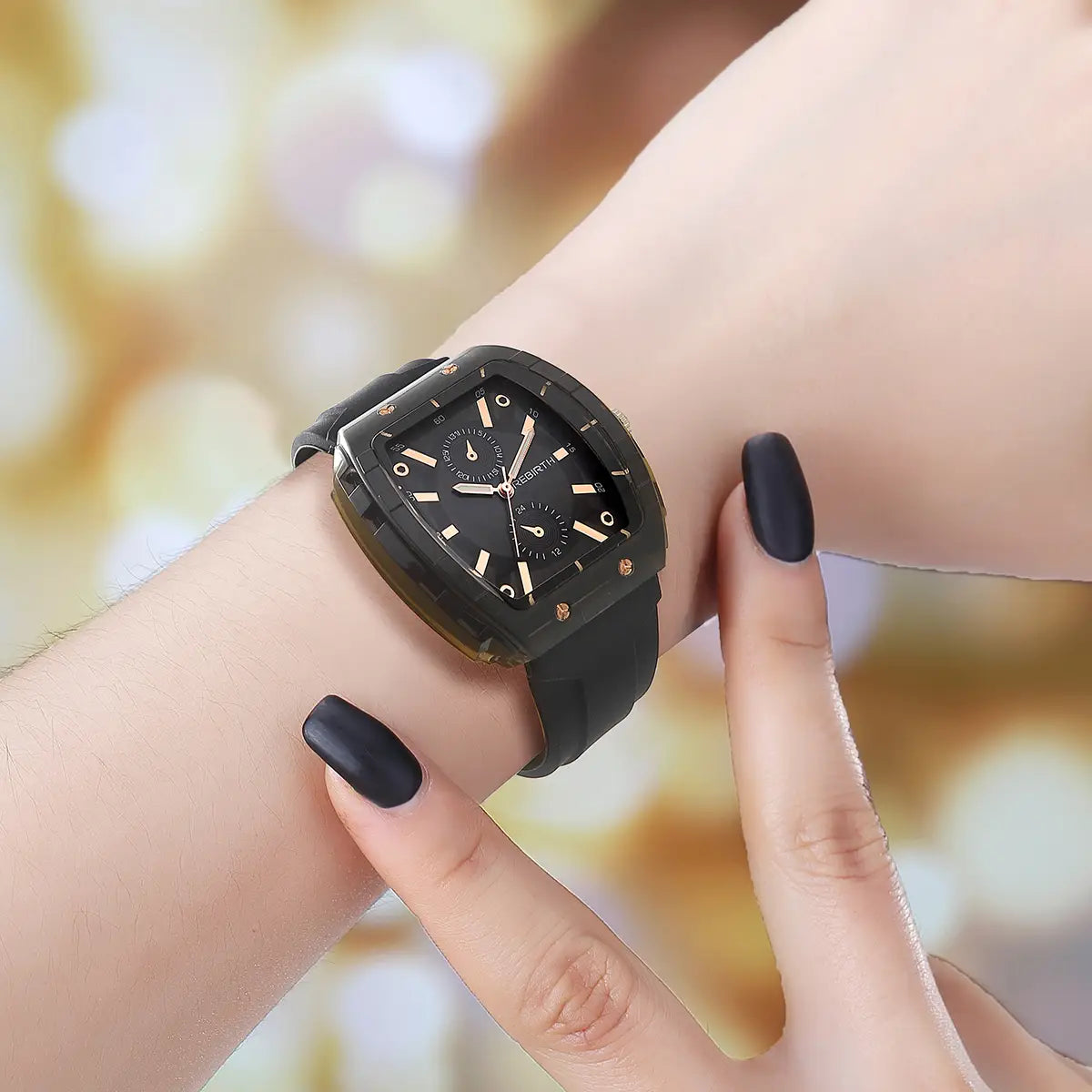 A black square-faced silicone casual watch with rose gold rectangular dial accents and a black rubber strap.