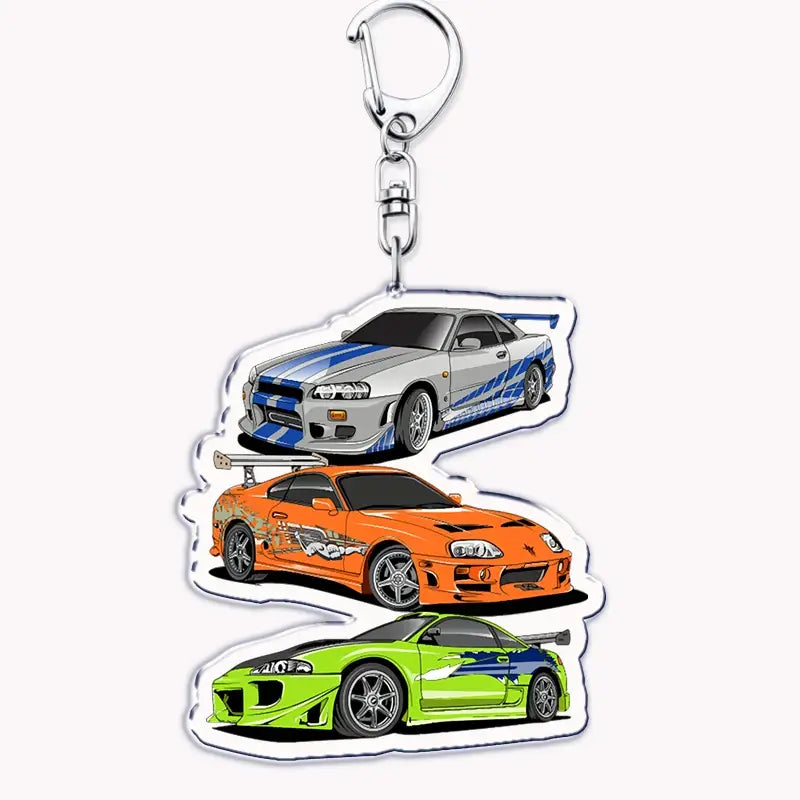 Silver and blue Nissan Skyline R34 acrylic car keychain featuring three iconic fast and furious cars in vibrant design.