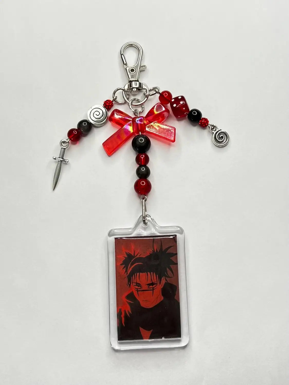 Red and black beaded keychain with a clear acrylic charm featuring an anime character portrait choso y2k anime beaded acrylic keychain.