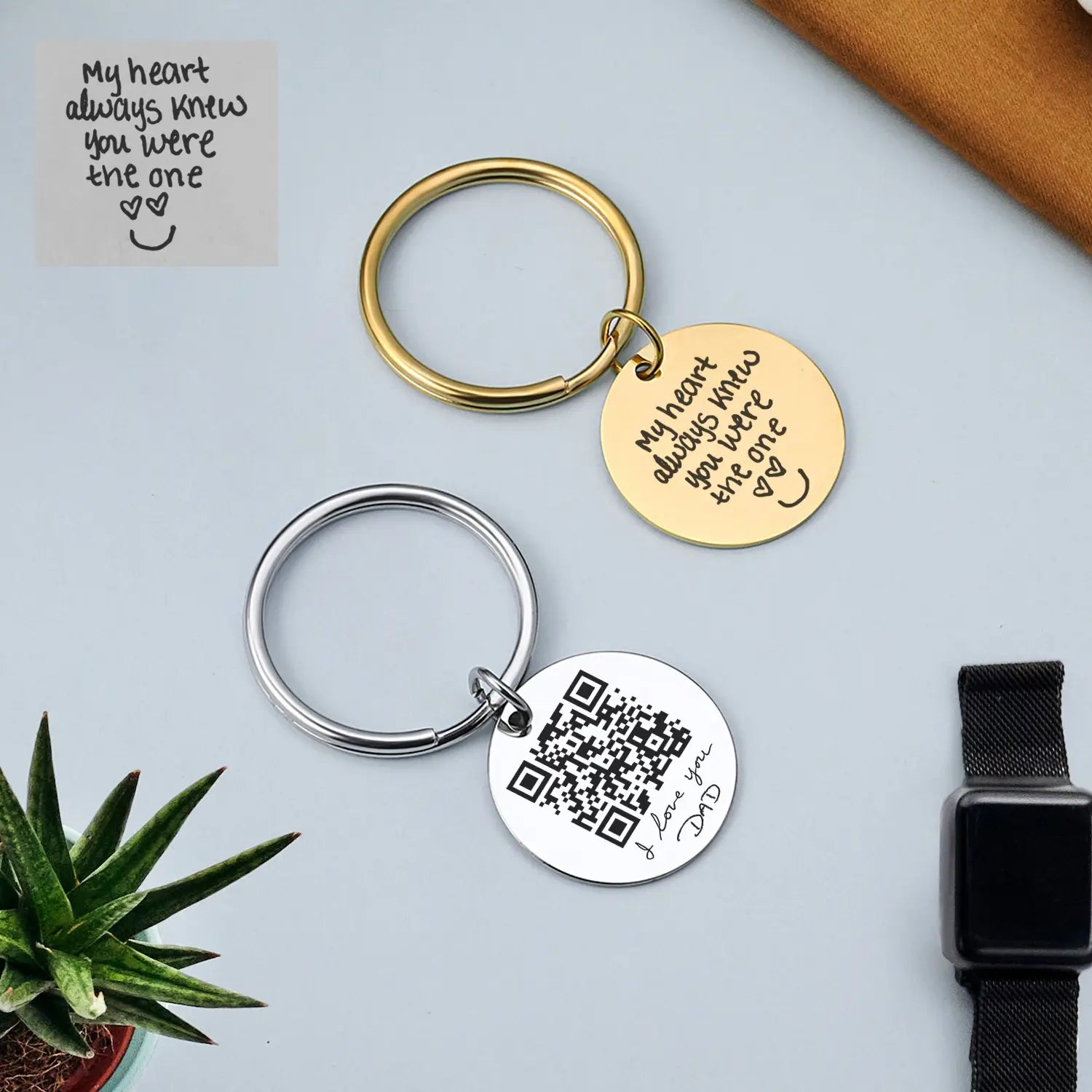 gold and silver metal personalized fingerprint qr code keychains each with a circular disc engraved with custom messages or qr codes for gift purposes