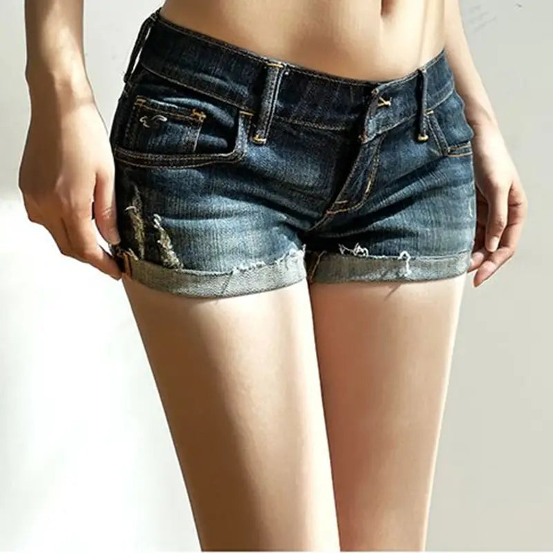 Women dark blue slim fit denim shorts featuring frayed hems and distressed details.