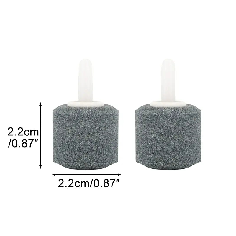 Gray cylindrical sponge air stones with white plastic stems for air tube fish tank accessories kit including check valves.