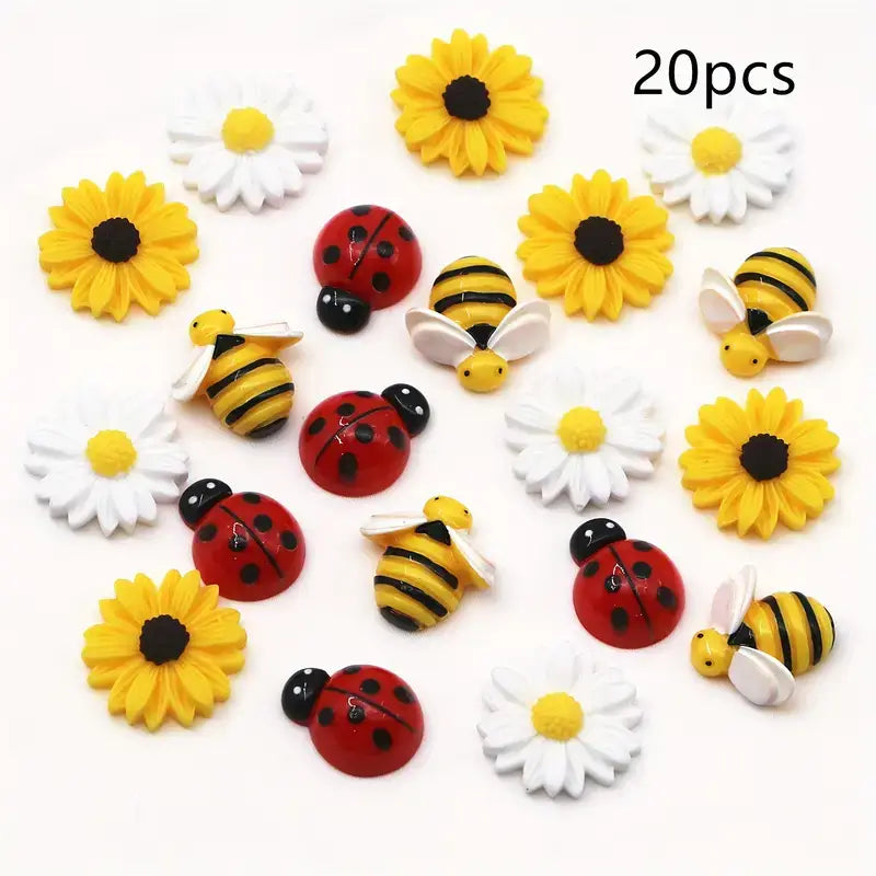Set of 20pcs mixed resin daisy bee and ladybug flatback charms featuring colorful yellow sunflowers white daisies red ladybugs with black spots and striped yellow and black bees.