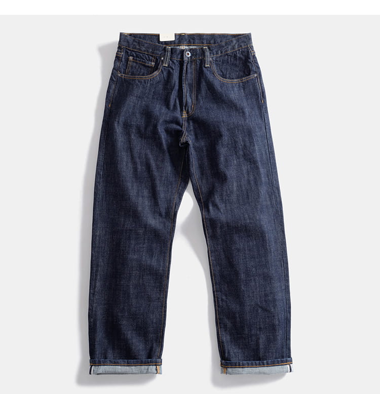 Dark indigo heavyweight red selvedge denim jeans with classic five-pocket design and rolled cuffs.