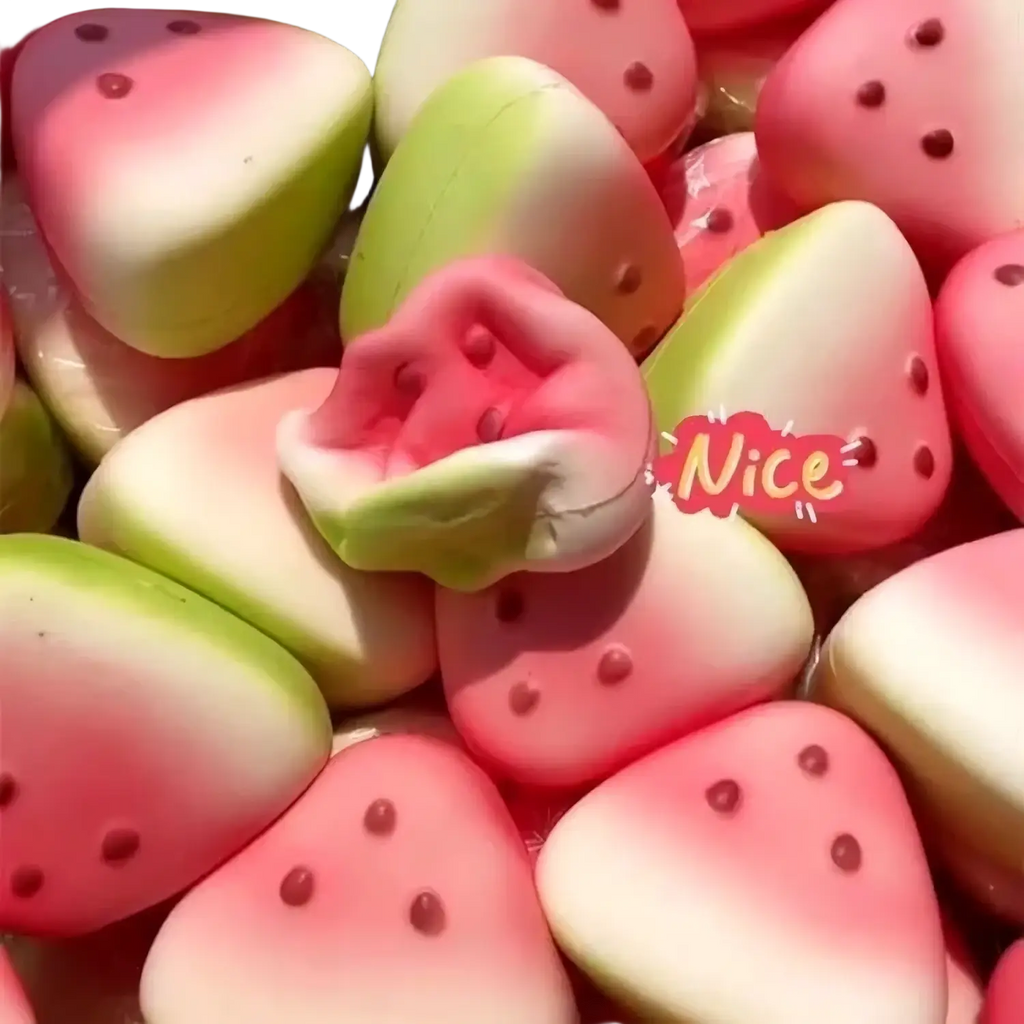 Pink and green watermelon-shaped squishy fidget toys with black seed details shown from a front angle