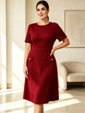 Elegant burgundy formal dress for women; autumn midi-length wedding guest dress featuring lace paneling; suitable for business c