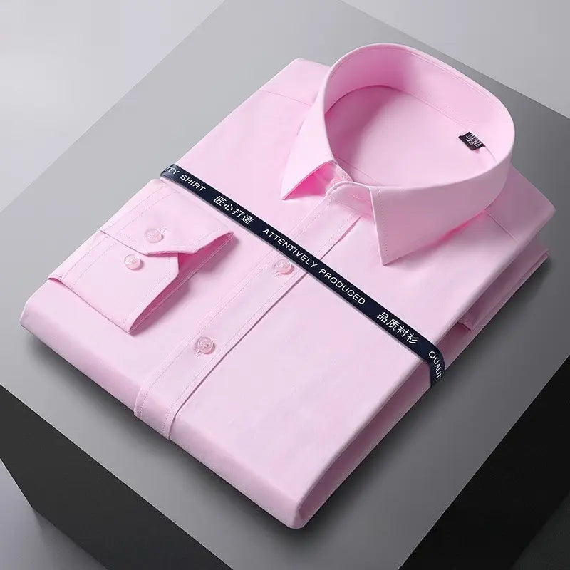 A neatly folded pink men long sleeve dress shirt with a classic collar and buttoned cuffs wrapped by a black branded ribbon designed for formal office wear with anti wrinkle fabric.
