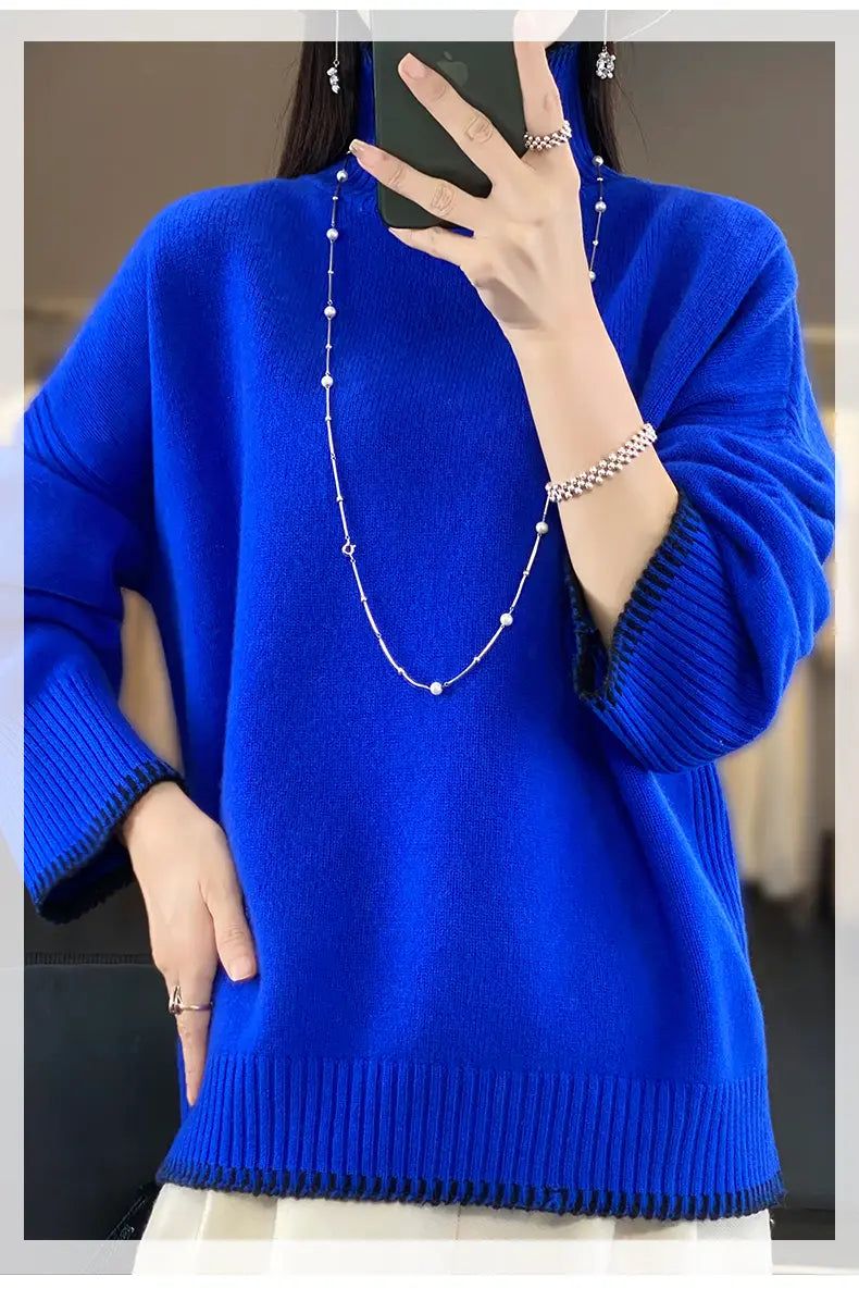 A vibrant royal blue pure wool turtleneck sweater for women featuring ribbed cuffs and hem.