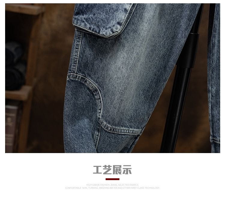 Men denim cargo jeans casual loose pants in blue denim with multiple pockets and a faded worn-in look.