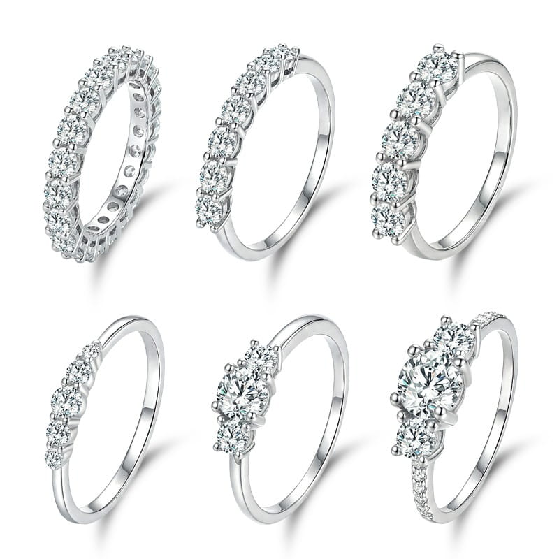 Six silver-toned sterling silver zircon rings for women in various styles including band and three-stone designs.