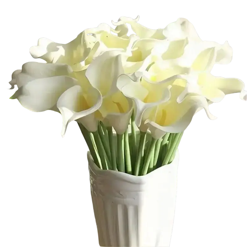 A bouquet of artificial white calla lilies with creamy yellow centers arranged in a textured white ceramic vase