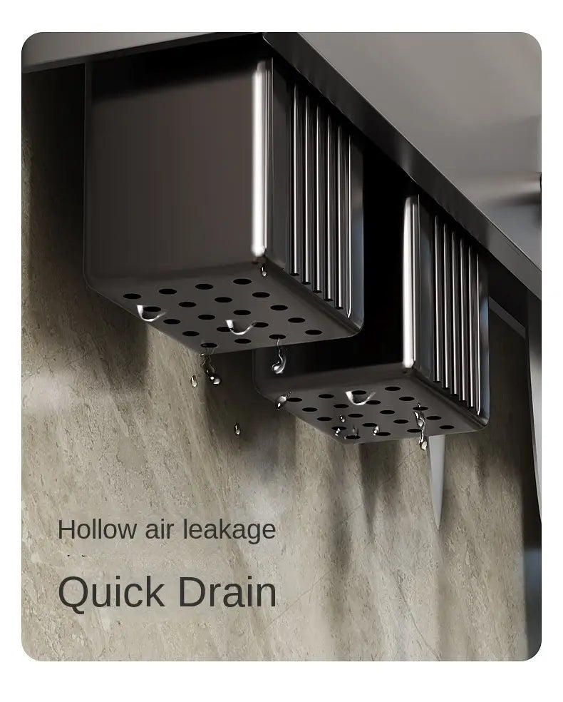 Black rectangular wall mounted kitchen utensil holder and knife rack with perforated metal sides and vertical ridges.