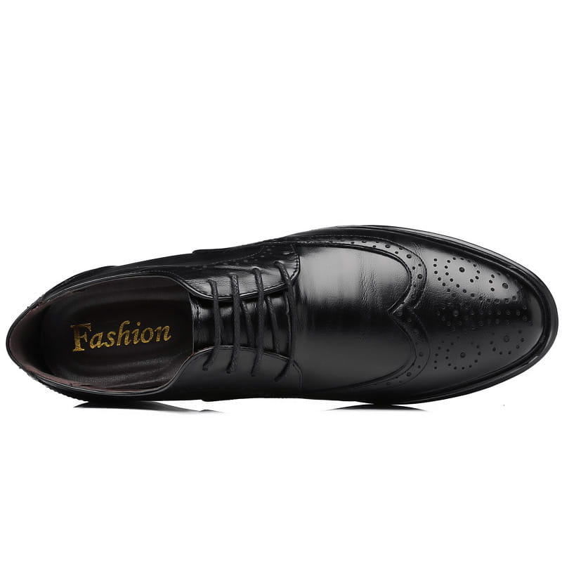 Men’s leather brogue dress shoe in black featuring oxford style with detailed brogue perforations and laces.
